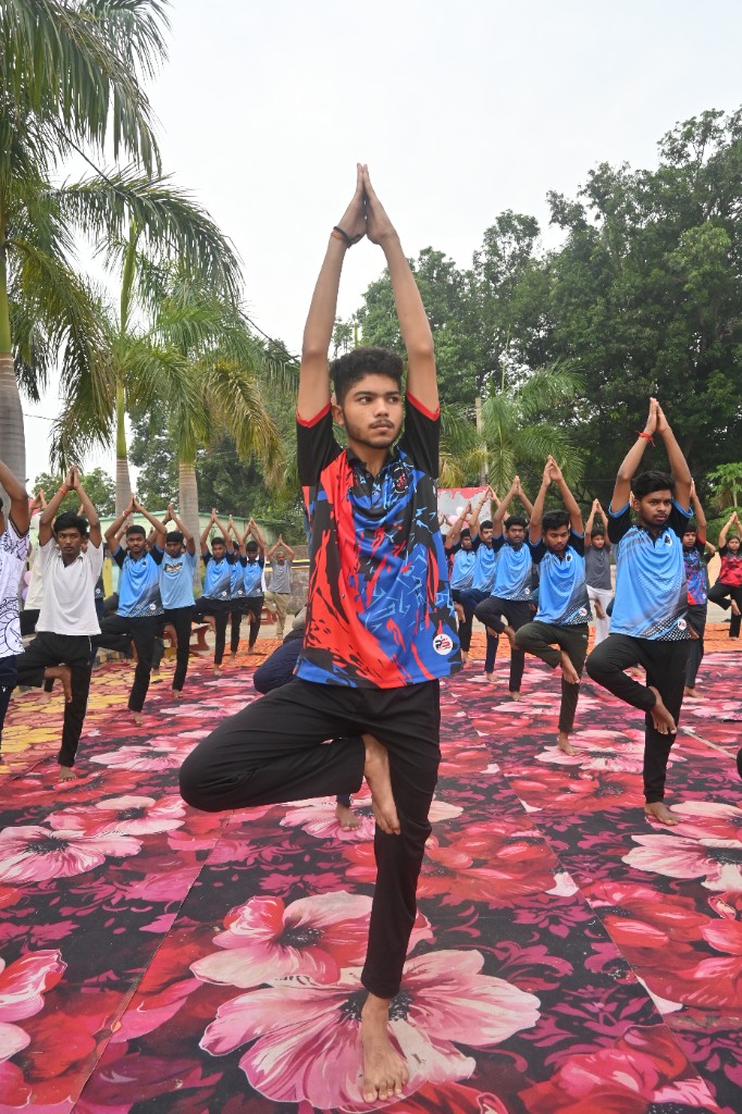 Students performing tree pose during yoga class